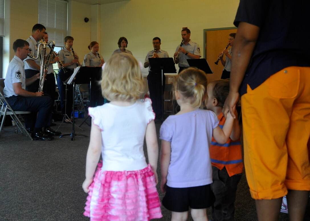 Students at Joint Base Anacostia-Bolling's Child Development Center II stand for the playing of the National Anthem by The U.S. Air Force Band's Clarinet Choir June 16, 2013. The choir performed for three groups of children at the JBAB CDCII during the morning of music. (U.S. Air Force photo/Senior Airman Lindsey A. Porter)