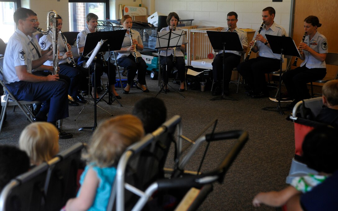 Students at Joint Base Anacostia-Bolling's Child Development Center II stand for the playing of the National Anthem by The U.S. Air Force Band's Clarinet Choir June 16, 2013. The choir performed for three groups of children at the JBAB CDCII during the morning of music. (U.S. Air Force photo/Senior Airman Lindsey A. Porter)