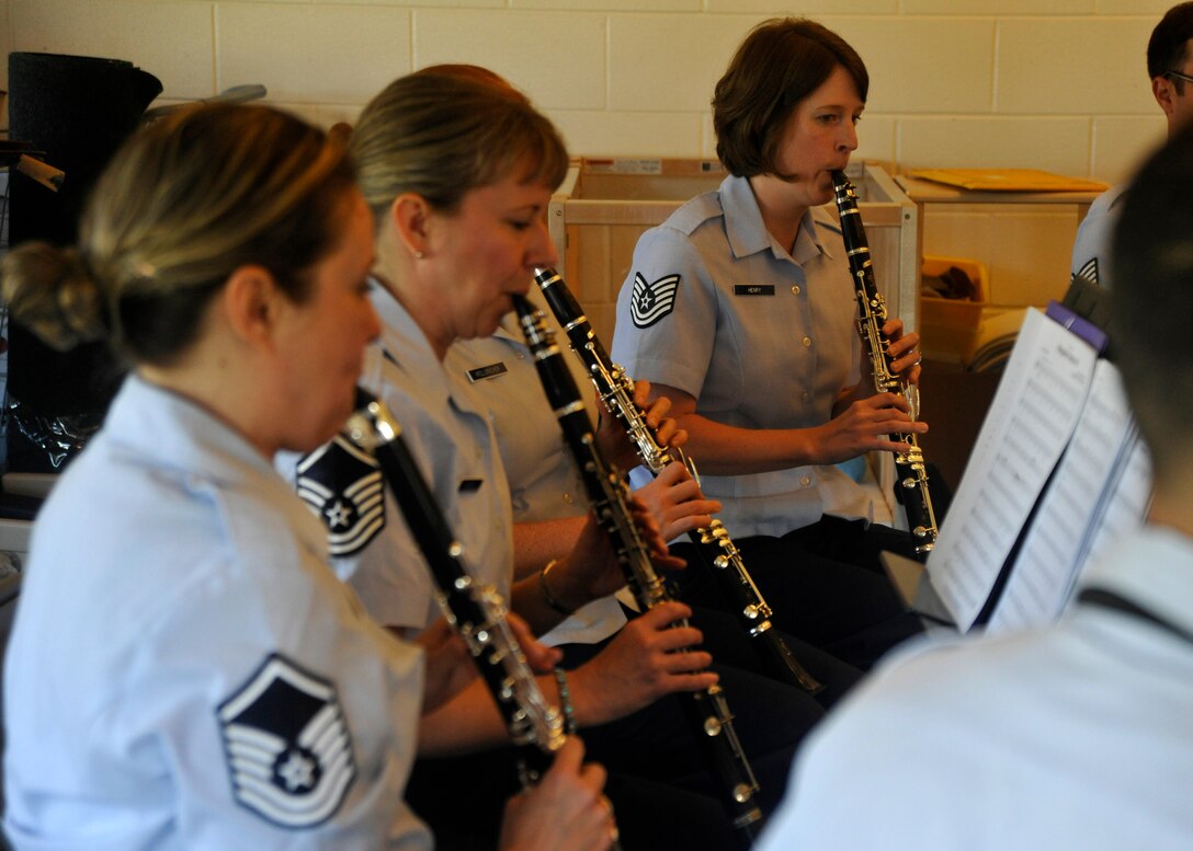 Members of The U.S. Air Force Band's Clarinet Choir perform for students at the Joint Base Anacostia Bolling Child Development Center II June 16, 2013. CDC II students spent the morning enjoying the choir's music and were even given the opportunity to perform alongside the choir by shaking rattling noise makers during a few song selections. (U.S. Air Force photo/Senior Airman Lindsey A. Porter)