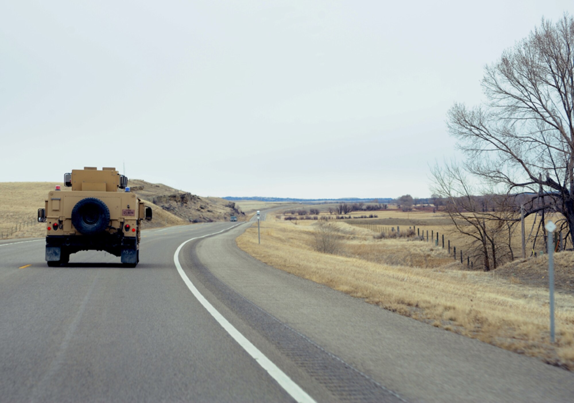 341st Missile Security Forces Squadron Airmen travel across a Montana highway to a 490th Missile Squadron Launch Facility to perform a routine security check March 12, 2013. Each of the 341st Missile Wing’s three missile squadrons control 50 Minuteman III ICBM launch facilities. (U.S. Air Force photo/Staff Sgt. R.J. Biermann)