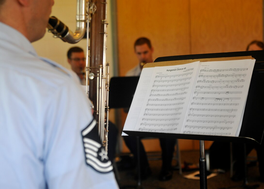 A member of The U.S. Air Force Band's Clarinet Choir performs "Hungarian Dance #5" by Johannes Brahms at the Joint Base Anacostia Bolling Child Development Center II June 16, 2013. CDC II students spent the morning enjoying the choir's music which also included children's songs such as "Twinkle Twinkle Little Star" and the theme song to the cartoon animation Sponge Bob Square Pants. (U.S. Air Force photo/Senior Airman Lindsey A. Porter)