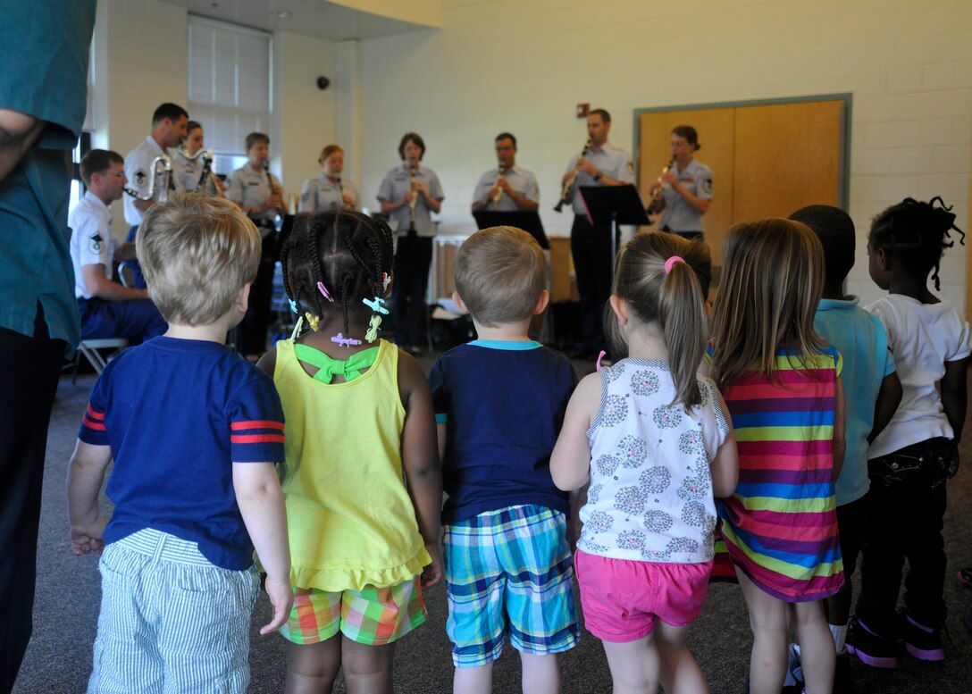 Students at Joint Base Anacostia-Bolling's Child Development Center II stand for the playing of the National Anthem by The U.S. Air Force Band's Clarinet Choir June 16, 2013. The choir performed for three groups of children at the JBAB CDCII. (U.S. Air Force photo/Senior Airman Lindsey A. Porter)