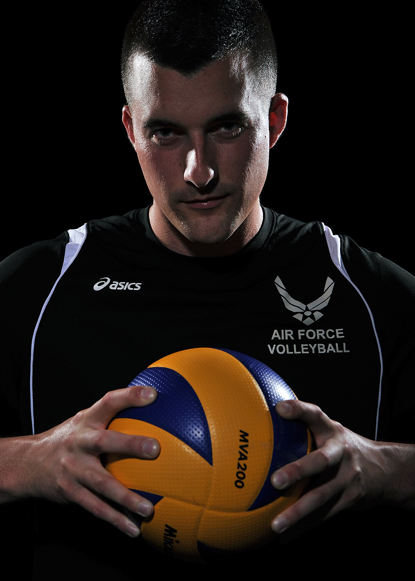Airman 1st Class Michael with his Air Force Volleyball jersey. (U.S. Air Force photo by Robert Scott/released)