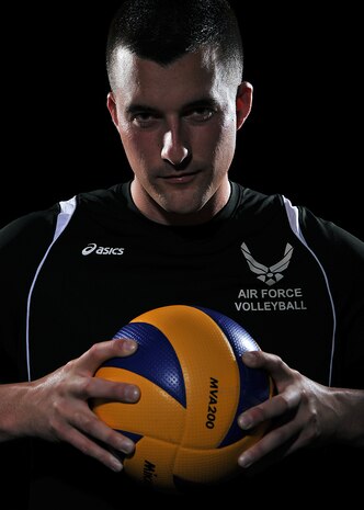 Airman 1st Class Michael with his Air Force Volleyball jersey. (U.S. Air Force photo by Robert Scott/released)