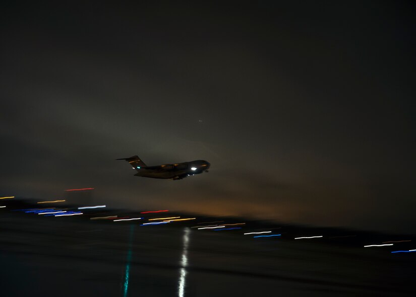 A C-17 Globemaster III takes off before a tropical storm enters the area June 6, 2013, at Joint Base Charleston – Air Base, S.C. All missions continued through the night since the storm’s intensity did not warrant grounding of aircraft. (U.S. Air Force photo/ Senior Airman Dennis Sloan)