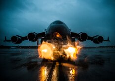 A C-17 Globemaster III is towed into position on the flightline to be chained in place due to approaching tropical storm Andrea June 6, 2013, at Joint Base Charleston – Air Base, S.C. The storm’s projected intensity was not strong enough to warrant evacuation, but the aircraft were chained as a precaution. (U.S. Air Force photo/Senior Airman Dennis Sloan) 

