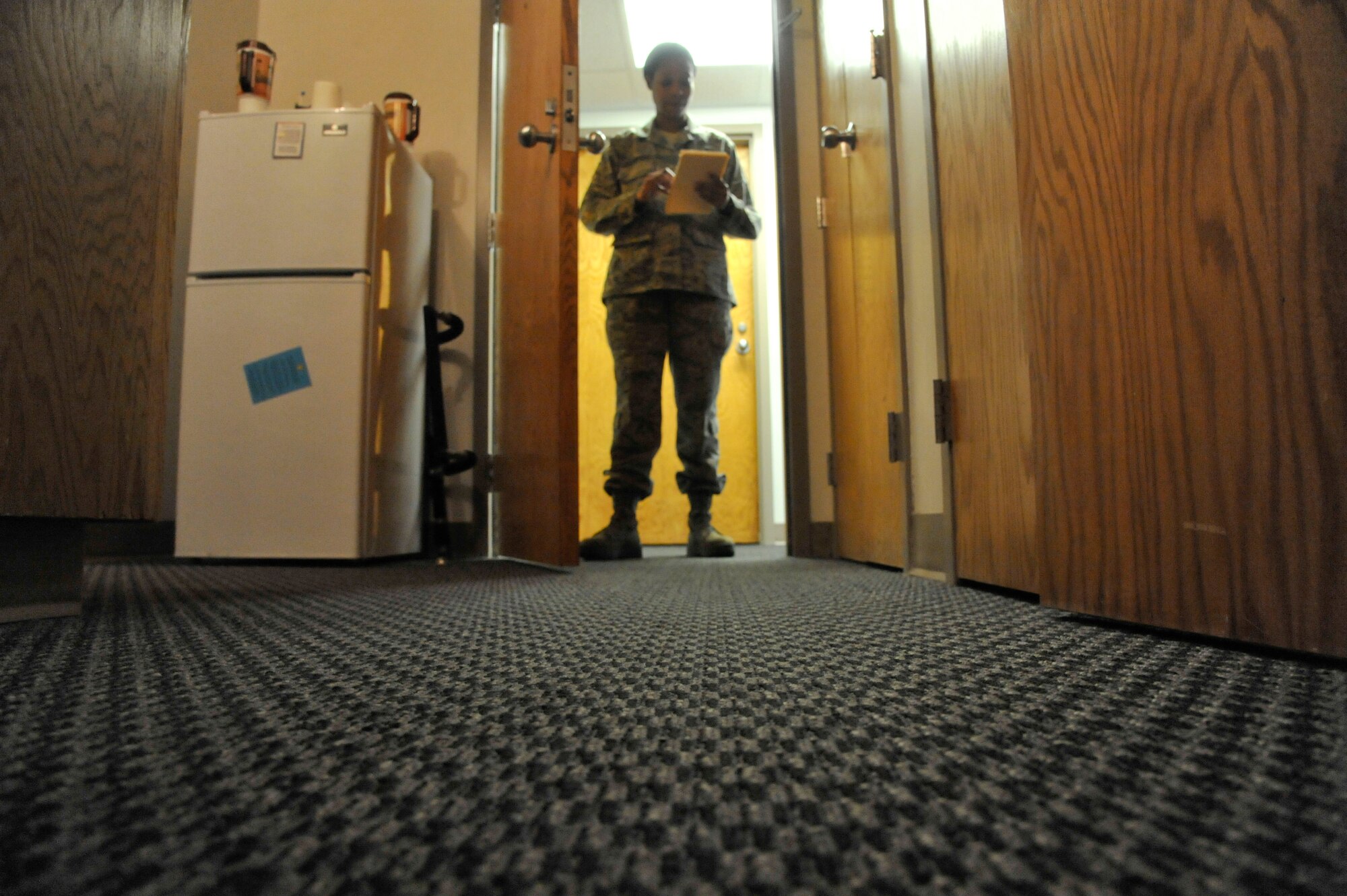 Master Sgt. Lafoundra Thompson, 509th Operations Group first sergeant, inspects a shower at Whiteman Air Force Base, Mo., June 3, 2013. Thompson scanned for mildew, soap build-up, water-marks and any signs of neglect. (U.S. Air Force photo by Airman 1st Class Keenan Berry/Released)