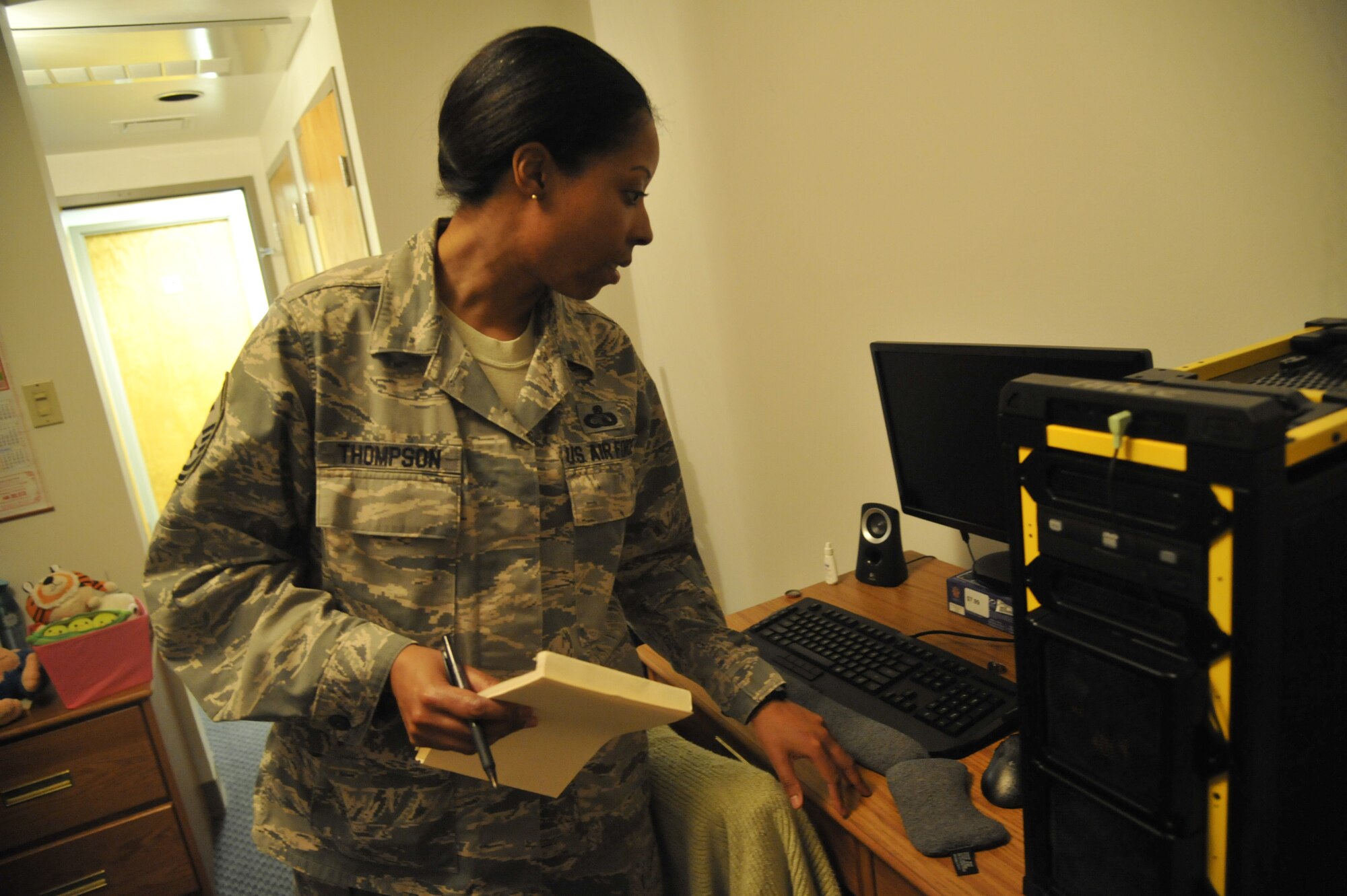 Master Sgt. Lafoundra Thompson, 509th Operations Group first sergeant, performs a standard dorm inspection at Whiteman Air Force Base, Mo., June 3, 2013. One thing inspectors look for is high levels of dust in the dorms, because dust can spread throughout a room, aggravating allergies and polluting electronic equipment. (U.S. Air Force photo by Airman 1st Class Keenan Berry/Released)