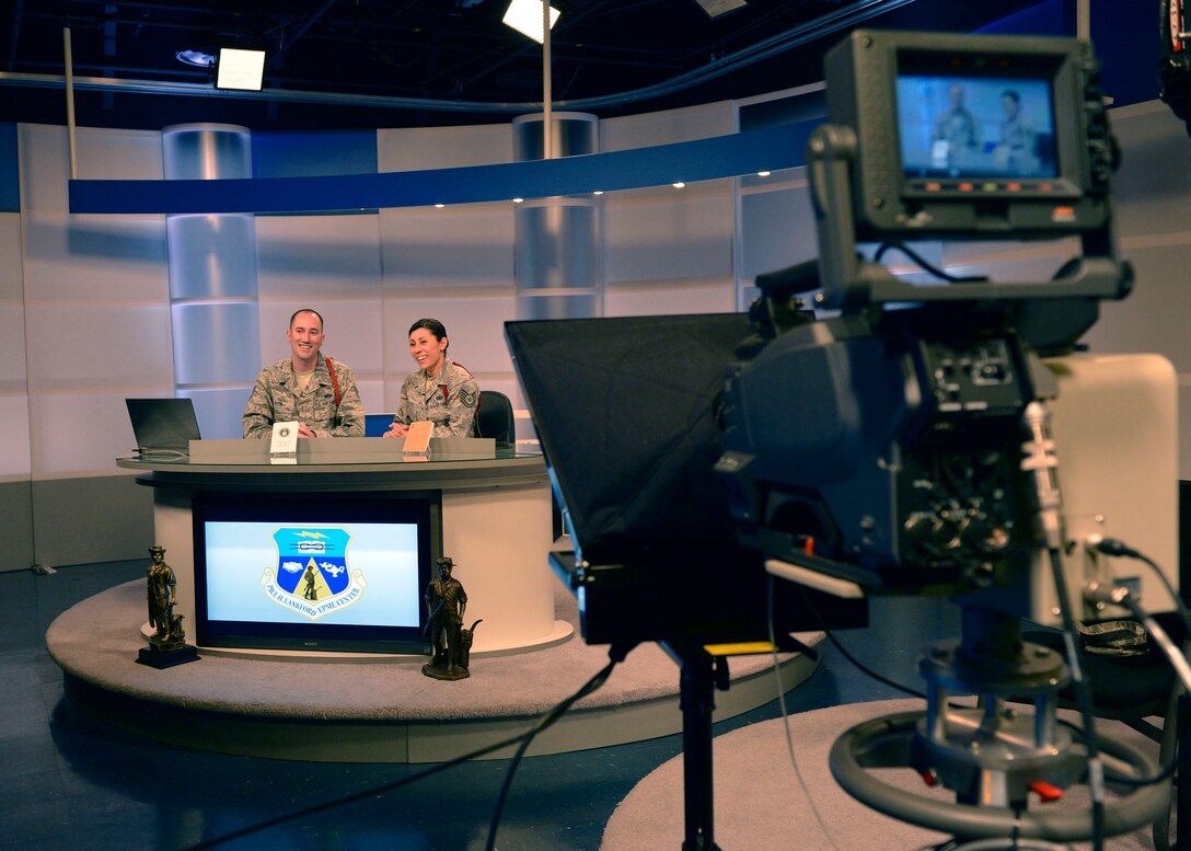 Tech. Sgt. Caleb Rose and Tech. Sgt. Jenny Sanchez, both enlisted professional education instructors at the Paul H. Lankford Enlisted Professional Military Education Center, McGhee Tyson Air National Guard Base, prepare for an upcoming television broadcast April 17, 2013. (U.S. Air Force photo/Master Sgt. Kurt Skoglund)