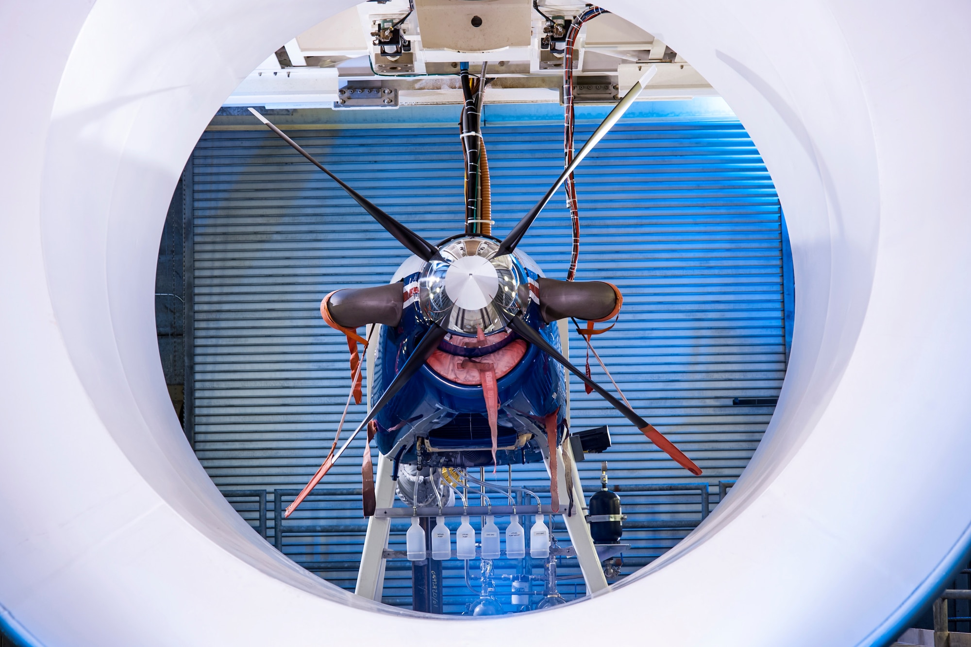 Pictured is a frontal view of the Pratt & Whitney Canada PT6A-68 turboprop engine installed in AEDC’s SL-1 test cell includes a special shroud to provide a simulated flight environment for the propeller. Without the shroud the propeller would create a pulse every time the blade passes at the closet point to the bottom of the test cell. (Photo by Rick Goodfriend) 