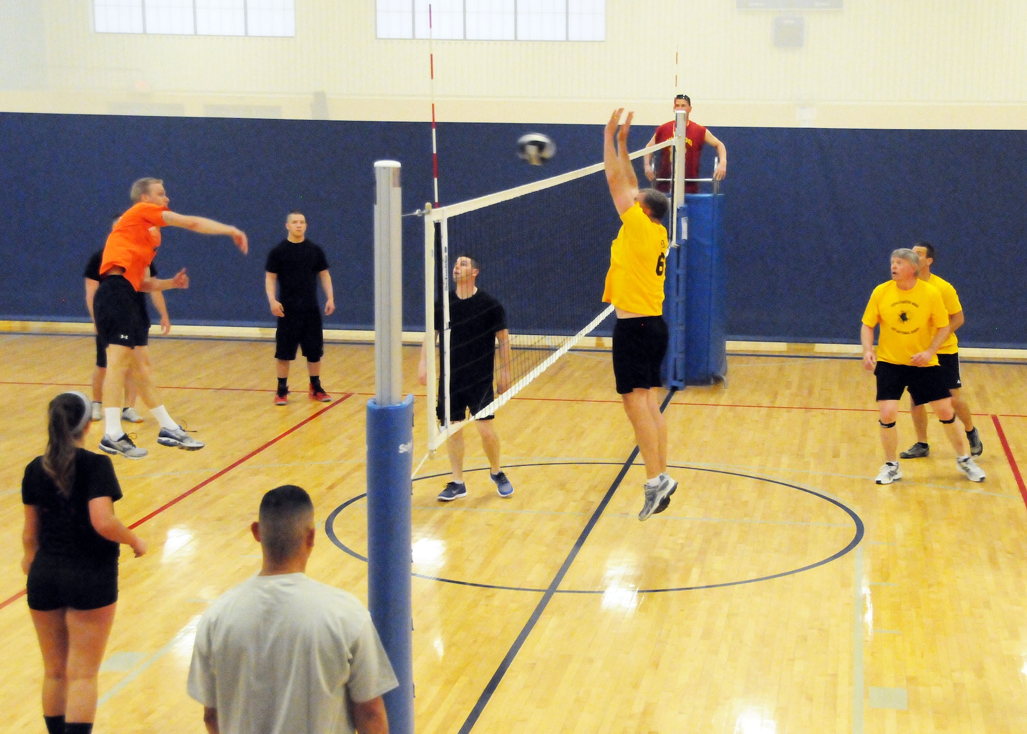 Senior Master Sgt. Steve Shovlin jumps to block a spike sent over the net by a member of the opposing team during the final Montana Air National Guard Vigilantes volleyball game played during the season playoffs held at the Malmstrom Fitness Center on May 14, 2013.  (U.S. Air Force photo/Senior Master Sgt. Eric Peterson)