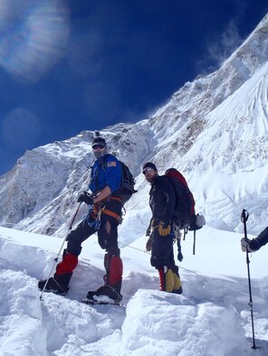 U.S. Air Force Capt. Kyle “Husky” Martin, left, a T-38 pilot and division chief for the 1st Operations Group, poses with  fellow team member of the U.S. Air Force 7 Summits team during their climb to reach Mount Everest. The team of six active-duty Airmen climbed summits to support resilience, raise money for charity and commemorate their fallen. (Courtesy photo by U.S. Air Force Capt. Colin Merrin/Released)