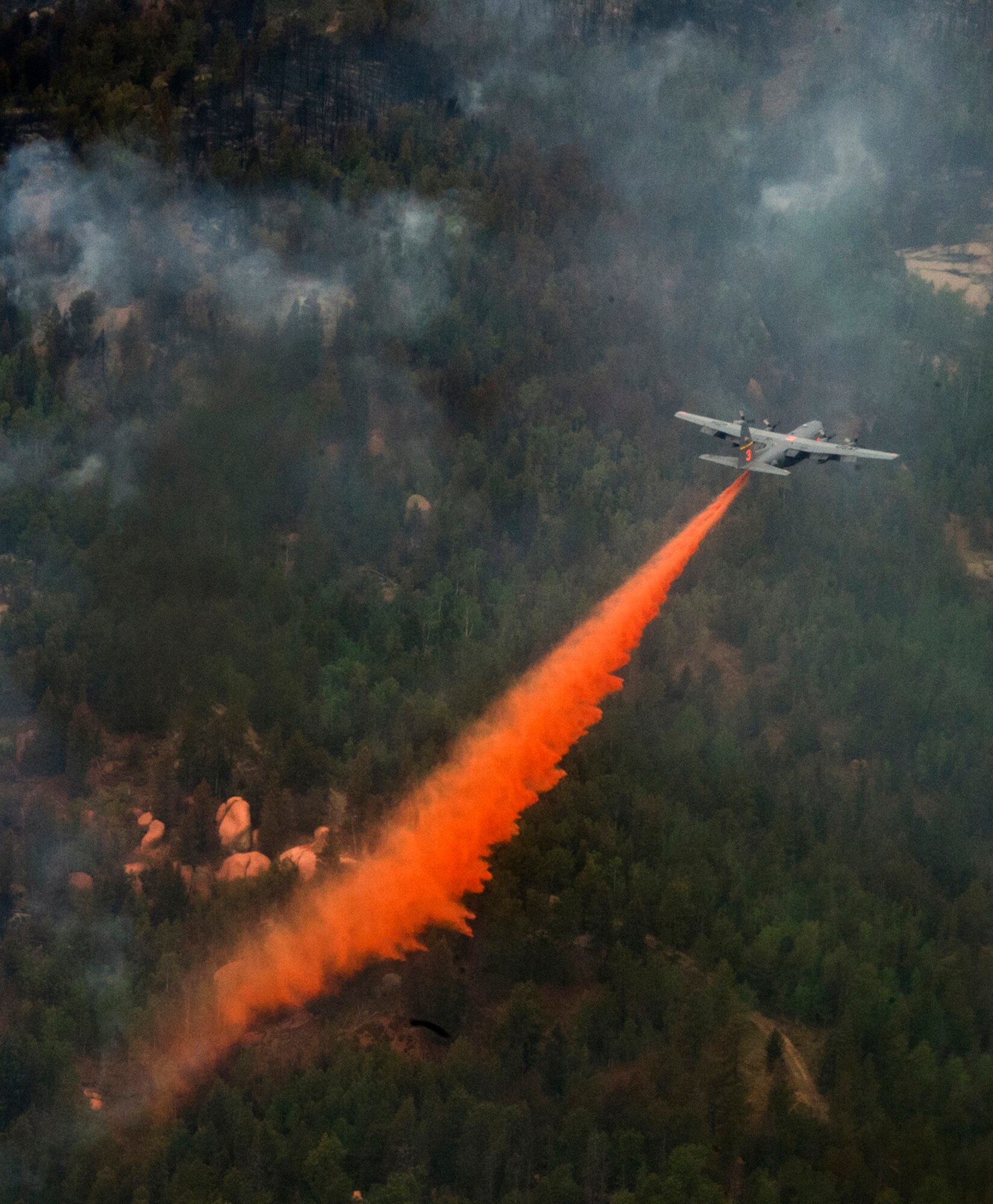 The 153rd Airlift Wing from Cheyenne WY use a modular air fire fighting system equipped C-130 Hercules aircraft in support of the Waldo Canyon wild fire in Colorado Springs, CO on June 27, 2012.  Four MAFFS-equipped aircraft from the 302nd and 153rd Airlift Wings flew in support of the U.S. Forest Service as they fought fires in Colorado.  MAFFS is a self-contained aerial fire fighting system that can discharge 3,000 gallons of water or fire retardant in less than five seconds, covering an area one-quarter of a mile long by 100 feet wide.
 (U.S. Air Force photo/Staff Sgt. Stephany D. Richards)