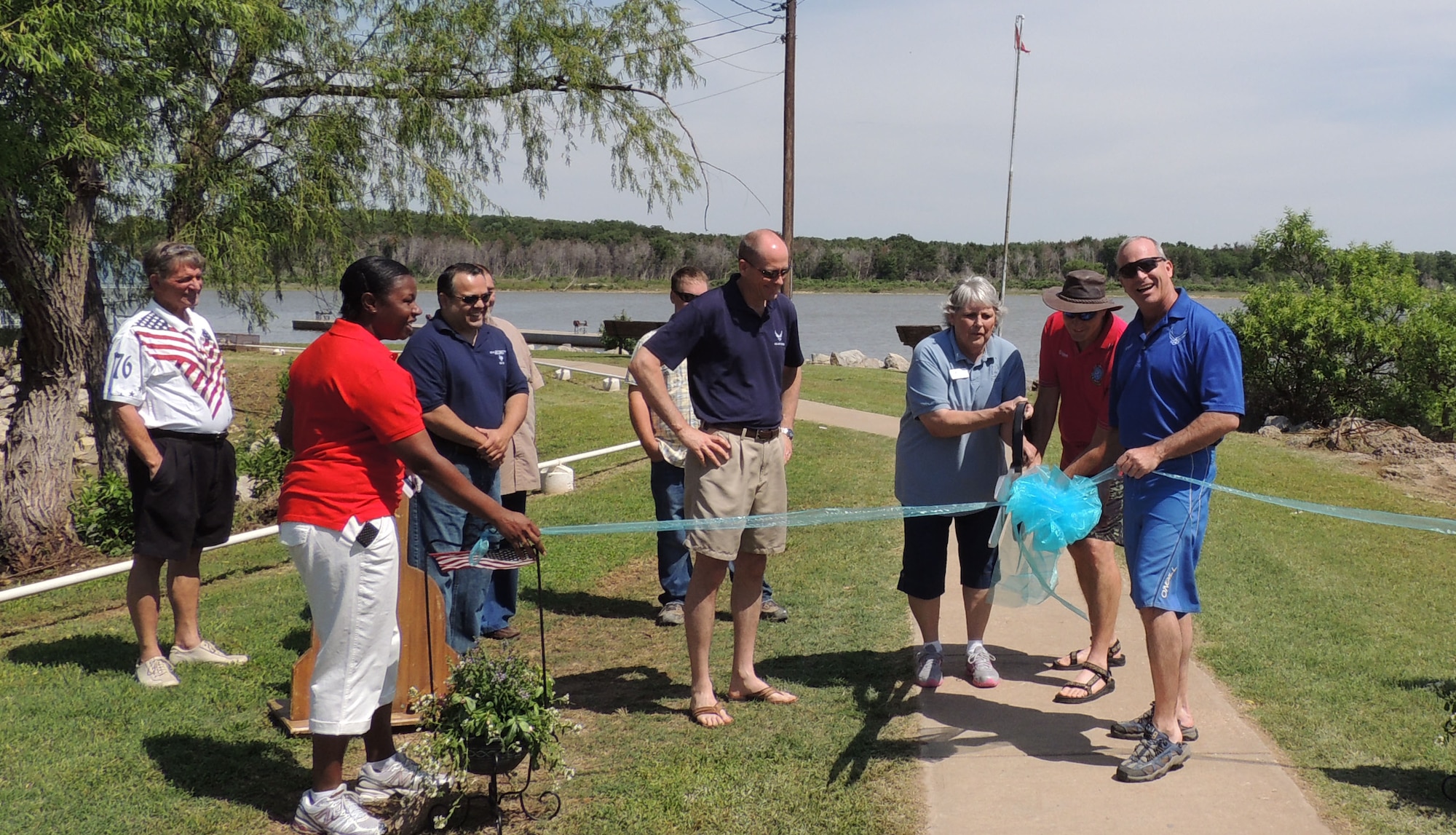 Brig. Gen. Michael Fantini, 82nd Training Wing commander, cuts the ribbon in the Crappie House renovation ceremony June 8. The Crappie house is a recreational annex where fishing takes place, and has been in the Wichita Falls and Sheppard community for more than 20 years. (U.S. Air Force courtesy photo) 