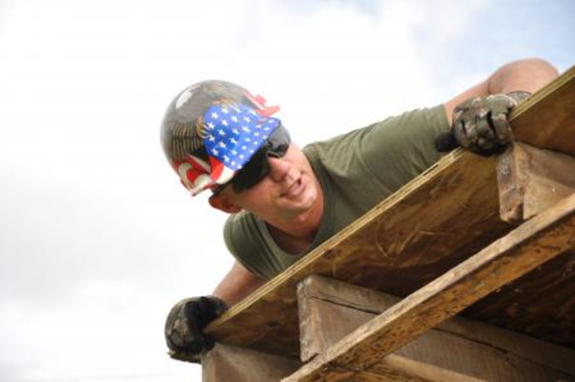 U.S. Marine Corps Sgt. Maximilian Beres, combat engineer from the Marine Wing Support Squadron 472, installs roof decking to repair a roof at Hattieville Government Pre-School June 4, 2013, as part of an exercise called New Horizons. Using excess building materials, the civil engineers plan to repair the leaky roof. Civil Engineers from both the U.S. and Belize are constructing various structures at schools throughout Belize as part of an exercise called New Horizons. Building these facilities will support further education for the children of the country and provide valuable training for U.S. and Belizean service members. (U.S. Air Force photo/Capt. Holly Hess)