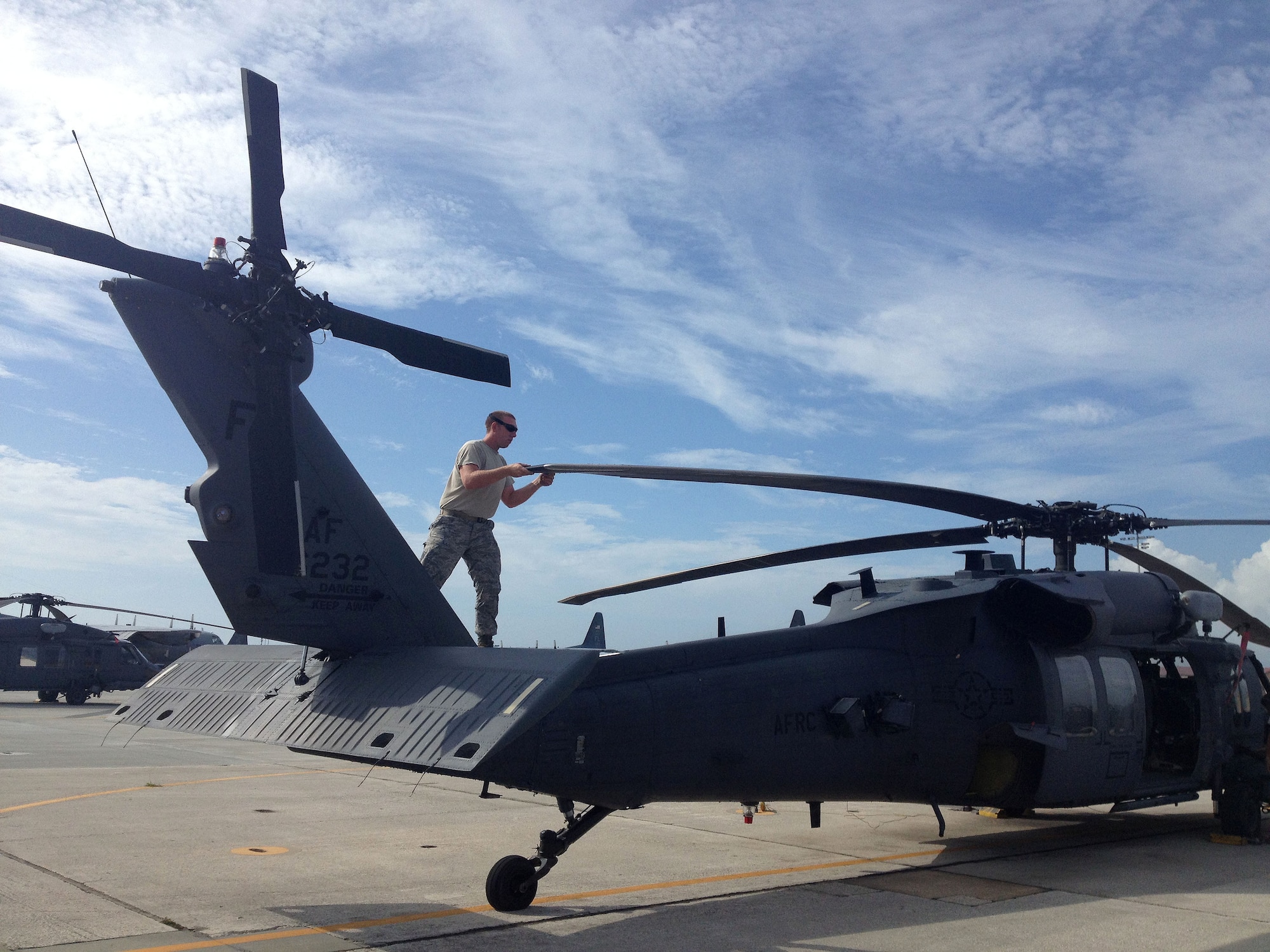 Airman Dennis Reiland, 920th Rescue Wing, Patrick Air Force Base, Fla., reserve crew chief on the HH-60G Pave Hawk helicopter, performs a pre-flight inspection on the rescue helicopter. These inspections are done daily to ensure the aircraft are rescue-ready at a moment's notice. The 920th RQW is the Air Force Reserve's only combat search and rescue wing. (U.S. Air Force photo/2nd Lt. Leslie Forshaw)