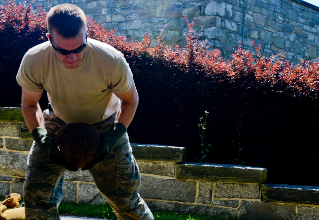 U.S. Air Force Staff Sgt. Matthew Hill, 633rd Civil Engineer Squadron Explosive Ordnance Disposal technician, loads a Civil War-era cannonball onto a truck for testing along with six other pieces of ordnance, from the Casemate Museum at Fort Monroe in Hampton, Va., May 30, 2013. The museum asked the EOD team to ensure its munitions were free of hazardous materials.  Hill said it was EOD’s mission to ensure the ordnance is safe to put on display or house.  (U.S. Air Force photo by Airman 1st Class R. Alex Durbin/Released)	