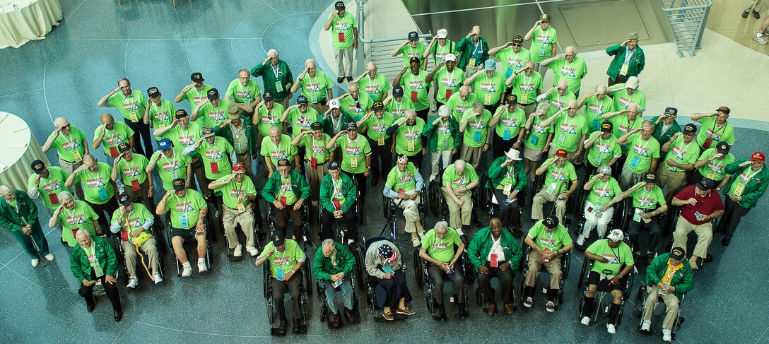 Veterans from the Honor Flight Historic Triangle Virginia program pose for a picture in Washington, D.C., June 8, 2013. Veterans and their guardians took the trip to Washington, D.C., to visit the memorials that were built in their honor. (Courtesy photo by U.S. Air Force Master Sgt. Kevin Ferrara)
