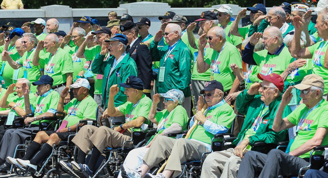 Veterans return a salute while on an Honor Flight trip to Washington, D.C., June 8, 2013. The Honor Flight program takes World War II and Korean War veterans to Washington, D.C., to see the memorials that were built in their honor. (Courtesy photo by U.S. Air Force Master Sgt. Kevin Ferrara)