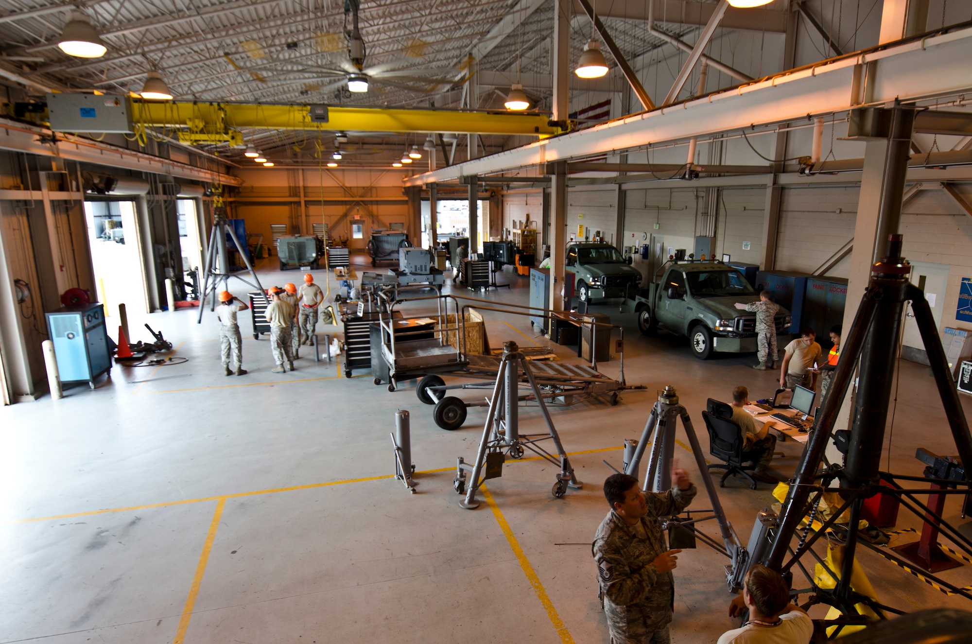 Aerospace Ground Equipment  maintainers work in at the AGE shop on Hurlburt Field, Fla., June 4, 2013. AGE mechanics repair,service, and  inspect more than 750 pieces of powered and non-powered equipment required for aircraft maintenance.
(U.S. Air Force Photo/ Staff Sgt. John Bainter)
