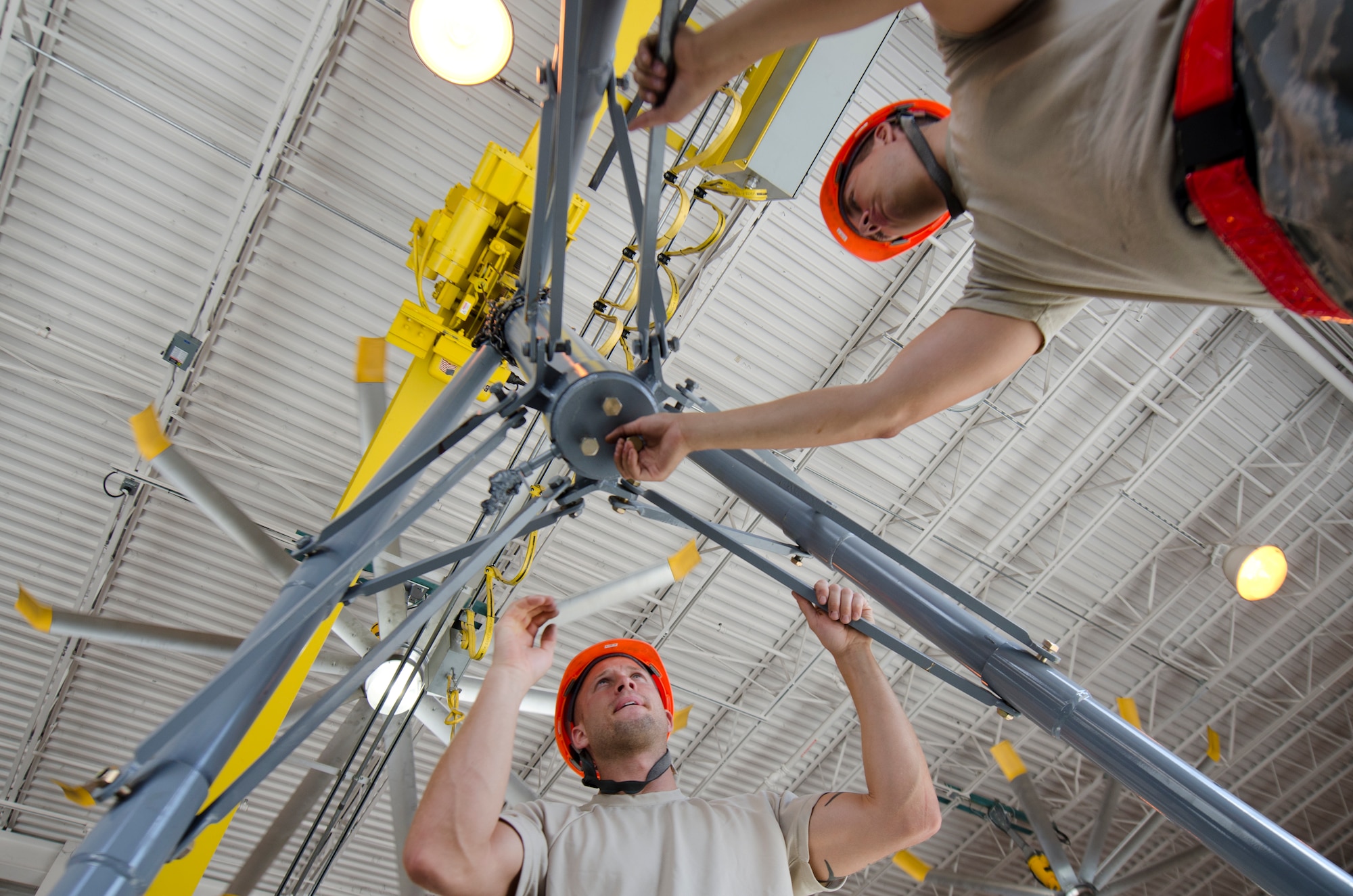 Staff Sgt. Brian Mathias and Airman 1st Class Devin Fraley assemble a 30-ton aircraft jack at the aerospace ground equipment shop on Hurlburt Field Fla., June 4, 2013. The mechanics at the AGE shop are responsible for repairing, inspecting and delivering  equipment, essential for aircraft maintenance. 
(U.S. Air Force Photo/ Staff Sgt. John Bainter)
