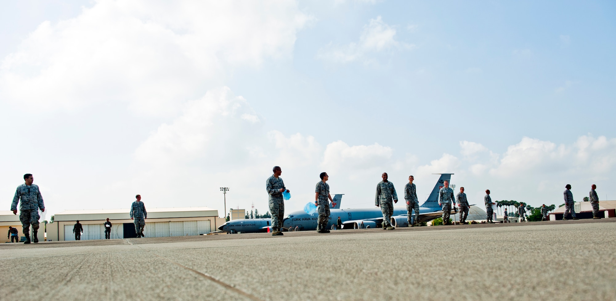Airmen from the 39th Air Base Wing walk the flightline searching for foreign object debris June 12, 2013, at Incirlik Air Base, Turkey.  The 39th ABW partnered with the Turkish air force 10th Tanker Base Command to clear the flightline of FOD to prevent aircraft mishaps. (U.S. Air Force photo by Senior Airman Daniel Phelps/Released)