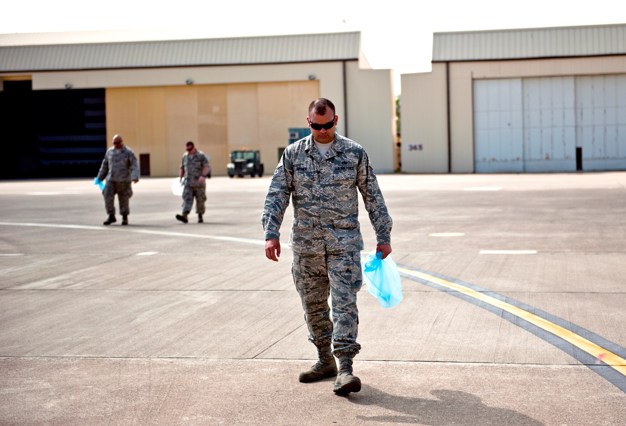 Tech. Sgt. Paul Archer, 39th Maintenance Squadron, searches for foreign object debris on the flightline June 12, 2013, at Incirlik Air Base, Turkey. The FOD walk was a combined effort between the 39th Air Base Wing and Turkish air force 10th Tanker Base Command to clear the area of debris that could potentially damage aircraft engines. (U.S. Air Force photo by Senior Airman Daniel Phelps/Released)