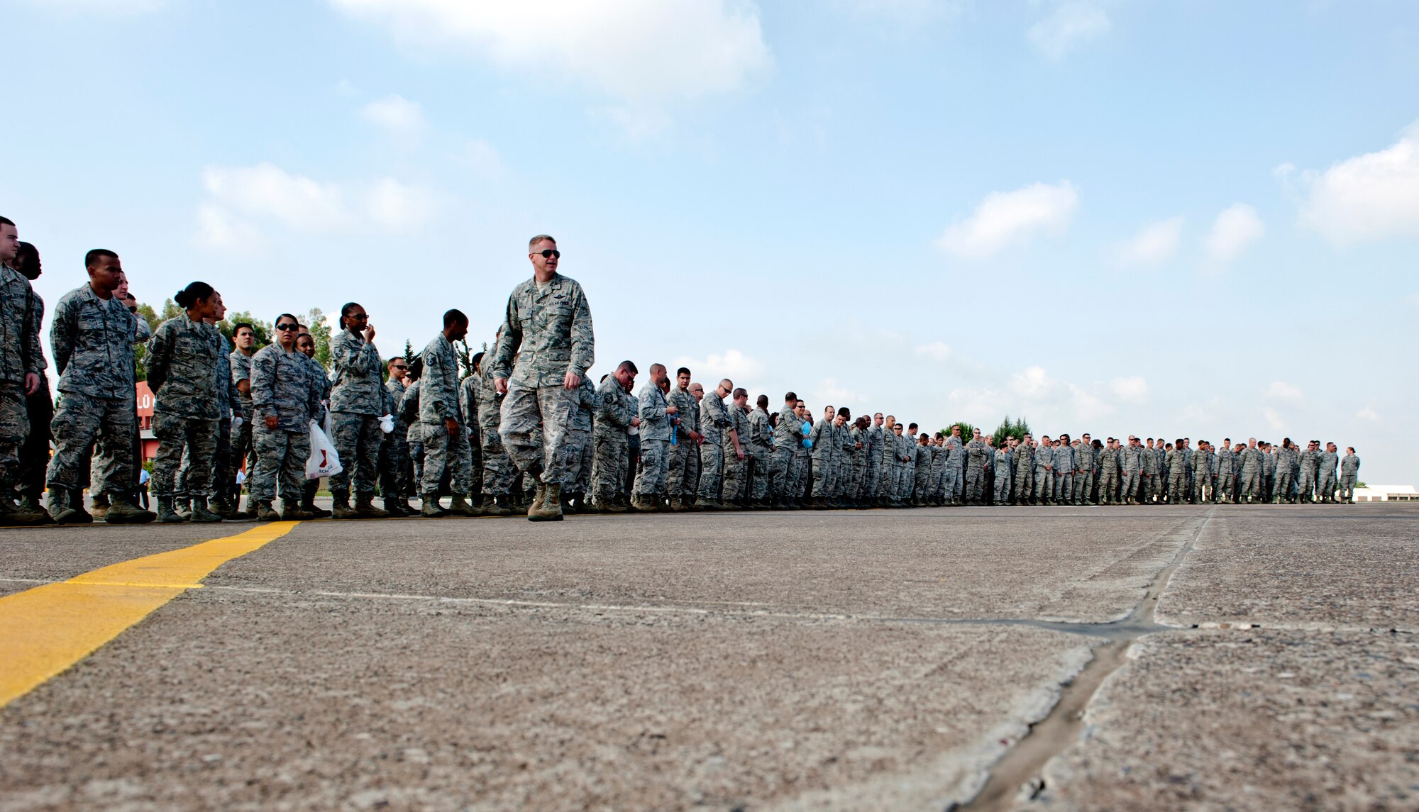 U.S. Air Force Col. Brent Bigger, 39th Air Base Wing vice commander, prepares 39th ABW airmen for the joint Turkish and U.S air force foreign object debris walk on the flightline June 12, 2013 at Incirlik Air Base, Turkey. The FOD walk was held to clear the flightline area of trash and debris that could potentially damage aircraft engines. (U.S. Air Force photo by Senior Airman Daniel Phelps/Released)
