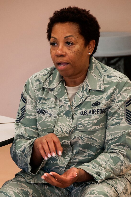 Senior Master Sgt. Sheila Sharp, 512th Maintenance Operations Flight plans and programs manager, discusses how Yellow Ribbon Reintegration Programs and the 512th Airman and Family Readiness Center helped her transition back into civilian life after her deployment during an education luncheon for air reserve technicians at the Dover Air Force Base, Del., Youth Center June 5, 2013. During the event, A&FR Center workers explained the many programs they have dealing with personal and family readiness, personal and family life skills, and personal financial management. (U.S. Air Force photo/Tech. Sgt. Mark R. W. Orders-Woempner)
