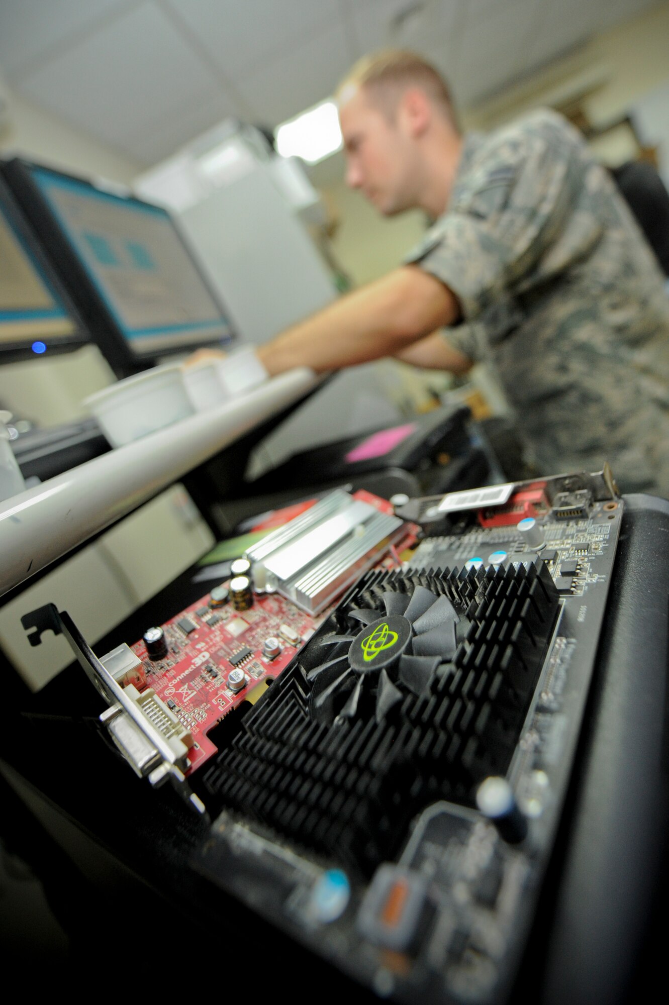 U.S. Air Force Airman 1st Class Braden Hoglan, 380th Expeditionary Communication Squadron small computer repair technician, clones a hard drive at an undisclosed location in Southwest Asia, June 11, 2013. The small computers shop clones hard drives to transfer data from an inoperable drive to a working one. Hoglan is native to Amesbury, Mass., and is deployed from Ramstein Air Base, Germany. (U.S. Air Force photo by Staff Sgt. Joshua J. Garcia)