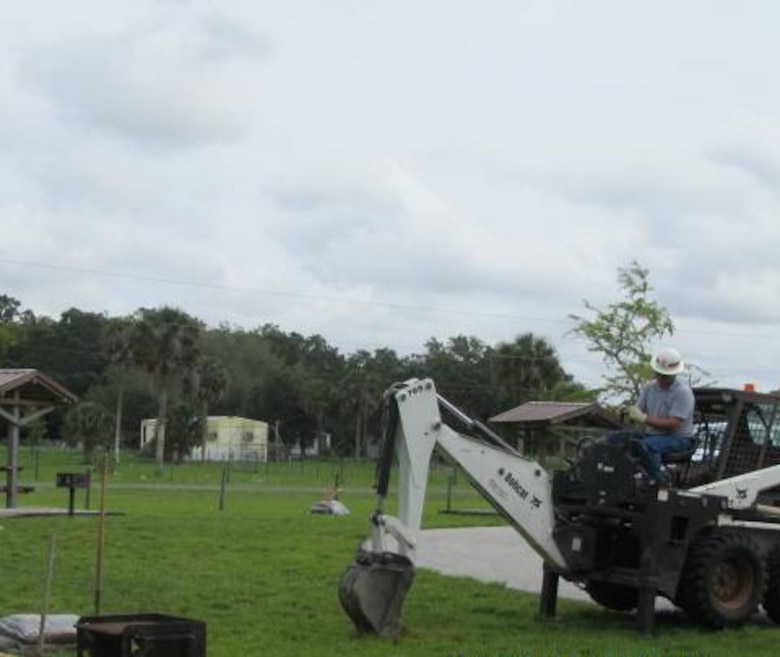 Graham Thompson, master tender from the Clewiston Office, digs holes for trees in advance of the event, making tree planting more efficient for volunteers the day of the Take Pride in America Day event. 