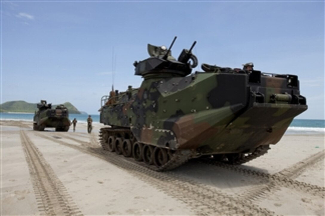 U.S. Marines with 3rd Marine Division, III Marine Expeditionary Force position their amphibious assault vehicles on the beach during an amphibious raid exercise with Royal Thai Marines at Hat Yao, Thailand, on June 10, 2013.  The raid is part of Cooperation Afloat Readiness and Training, or CARAT, exercise Thailand 2013.  CARAT is a series of bilateral military exercises between the U.S. Navy and the armed forces of Bangladesh, Brunei, Cambodia, Indonesia, Malaysia, the Philippines, Singapore, Thailand and Timor Leste.  