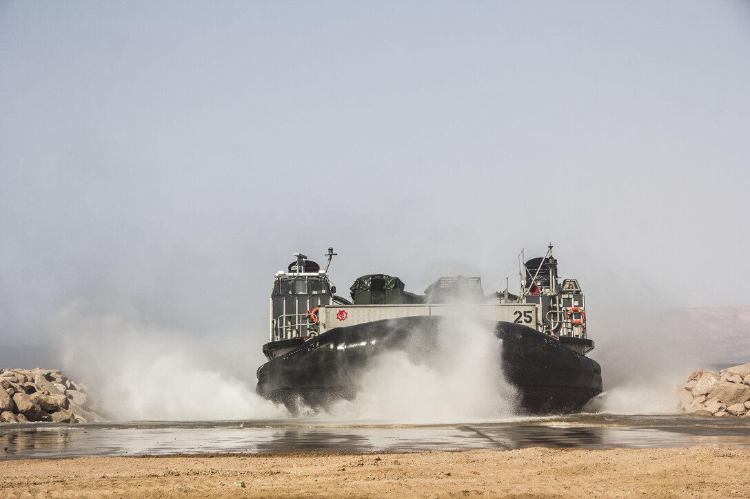 Marines and sailors of the 26th Marine Expeditionary Unit (MEU) bring gear ashore with a Navy landing craft, air cushion during amphibious landing operations on the coast of Jordan, June 6, 2013. The 26th MEU is a Marine Air-Ground Task Force forward-deployed to the U.S. 5th Fleet area of responsibility aboard the Kearsarge Amphibious Ready Group serving as a sea-based, expeditionary crisis response force capable of conducting amphibious operations across the full range of military operations.
(U.S. Marine Corps photo by Cpl. Michael S. Lockett/Released)
