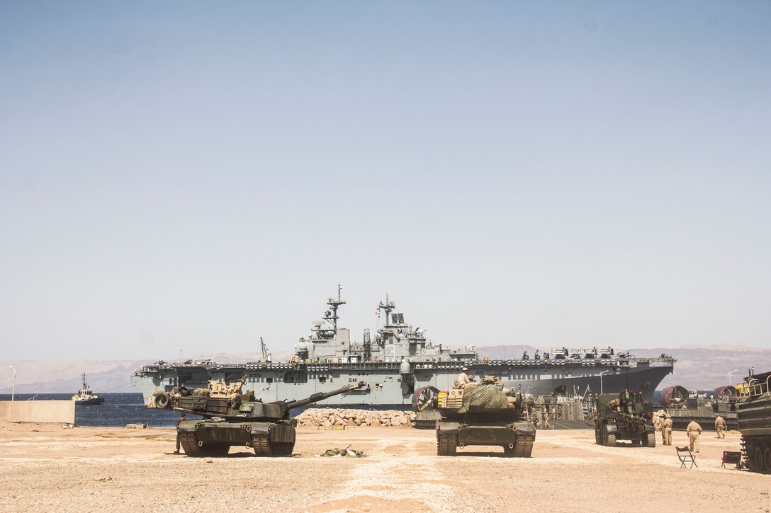 The USS Kearsarge (LHD 3) pulls in to port during the 26th Marine Expeditionary Unit's (MEU) amphibibious landing operations  on the coast of Jordan, June 6, 2013. The 26th MEU is a Marine Air-Ground Task Force forward-deployed to the U.S. 5th Fleet area of responsibility aboard the Kearsarge Amphibious Ready Group serving as a sea-based, expeditionary crisis response force capable of conducting amphibious operations across the full range of military operations.
(U.S. Marine Corps photo by Cpl. Michael S. Lockett/Released)
