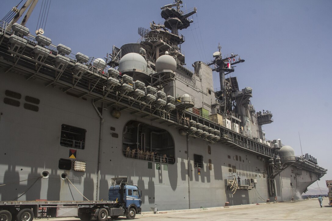 The USS Kearsarge (LHD 3) pulls in to port during the 26th Marine Expeditionary Unit's (MEU) amphibibious landing operations  on the coast of Jordan, June 6, 2013. The 26th MEU is a Marine Air-Ground Task Force forward-deployed to the U.S. 5th Fleet area of responsibility aboard the Kearsarge Amphibious Ready Group serving as a sea-based, expeditionary crisis response force capable of conducting amphibious operations across the full range of military operations.
(U.S. Marine Corps photo by Cpl. Michael S. Lockett/Released)
