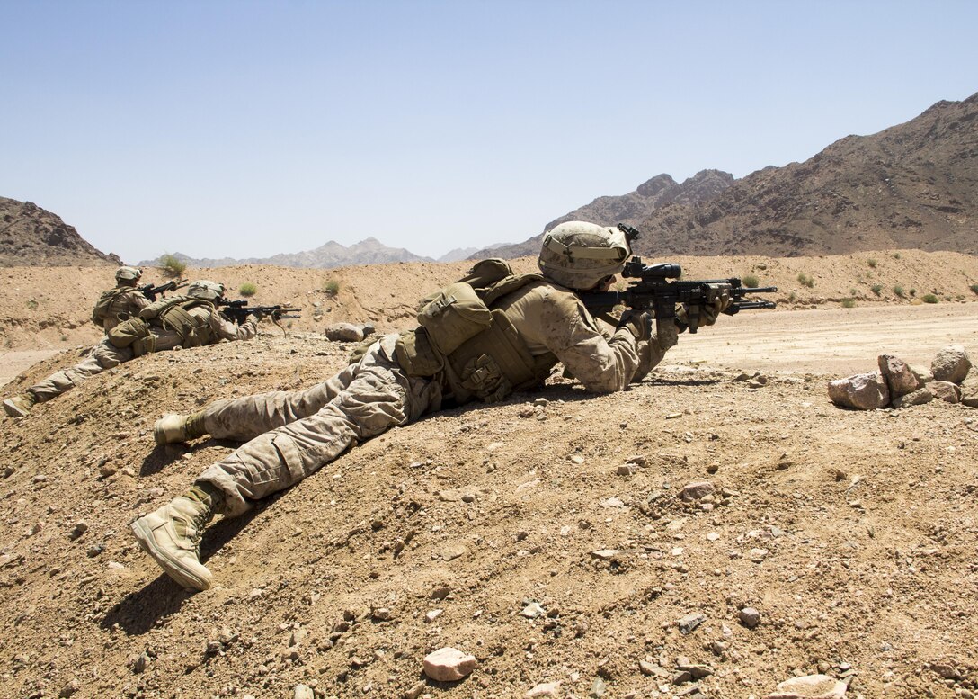 U.S. Marines assigned to Lima Company, Battalion Landing Team (BLT) 3/2, 26th Marine Expeditionary Unit (MEU), conduct live fire drills with M27 Infantry Automatic Rifles, during Exercise Eager Lion 13, June 10, 2013. Exercise Eager Lion 2013 is an annual, multinational exercise designed to strengthen military-to-military relationships and enhance security and stability in the region by responding to realistic, modern-day security scenarios. The 26th MEU is a Marine Air-Ground Task Force forward-deployed to the U.S. 5th Fleet area of responsibility aboard the Kearsarge Amphibious Ready Group serving as a sea-based, expeditionary crisis response force capable of conducting amphibious operations across the full range of military operations. (U.S. Marine Corps photograph by Lance Cpl. Juanenrique Owings, 26th MEU Combat Camera/Released)