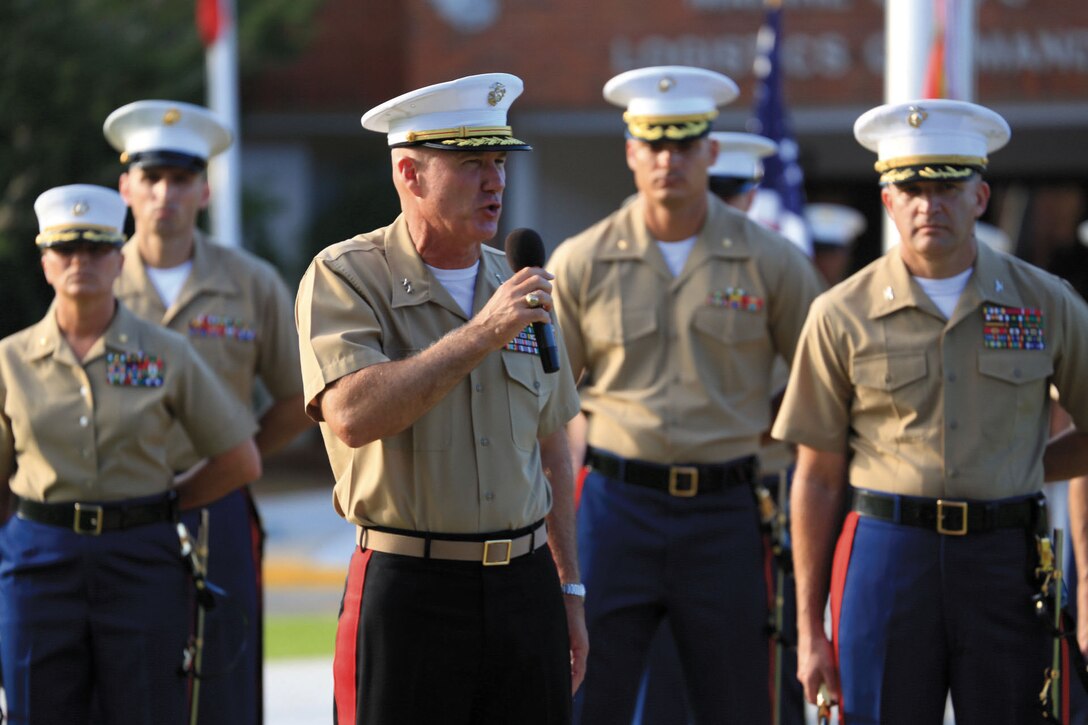 Maj. Gen. Charles L. Hudson, outgoing commanding general, Marine Corps Logistics Command, addresses Marines, Civilian-Marines, Sailors, distinguished guests and friends during his relinquishment of command ceremony, Friday, at MCLC’s parade field.