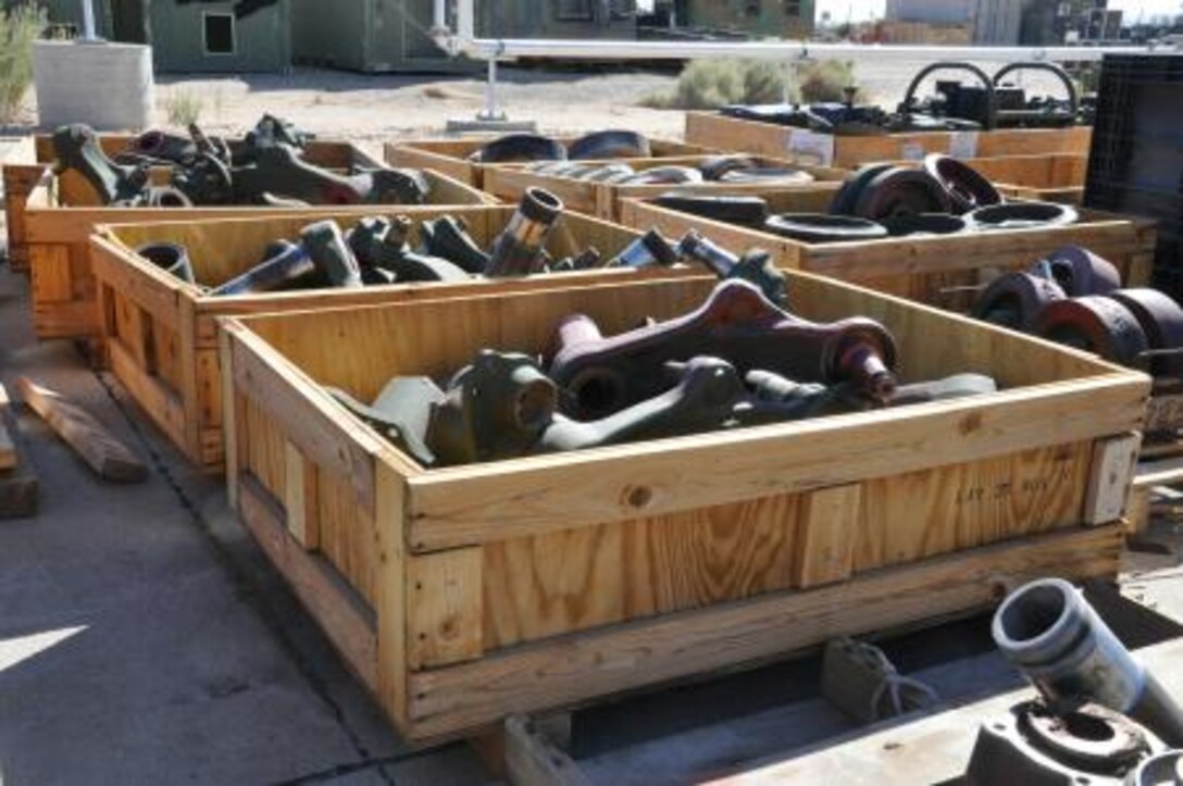 Bins filled with oil filters, glass, plastic, copper, and all types of scrap metal line the fence at Production Plant Barstow, Marine Depot Maintenance Command, where they will be relocated to a recycling facility and reused in the future.
