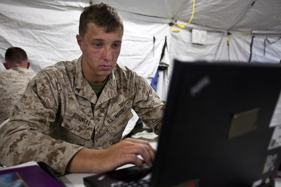Lance Cpl. Jarred Burnett, 22nd Marine Expeditionary Unit intelligence analyst and native of Levittown, Penn., creates an intelligence brief during the 22nd Marine Expeditionary Unit’s interoperability exercise at Marine Corps Base Camp Lejeune, N.C., June 12, 2013. Approximately 30 intelligence Marines from the MEU’s command and support element intelligence sections trained to efficiently mesh together in the fast-paced MEU setting for the unit’s upcoming deployment. (Marine Corps photo by Sgt. Austin Hazard/Released)