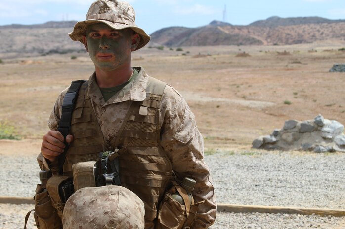 Pvt. Ryan K. Koroush, Platoon 2142, Company G, 2nd Recruit Training Battalion, prepares to patrol to the next event during the Crucible at Edson Range aboard Marine Corps Base Camp Pendleton, Calif., June 3. Koroush, 23, is older than most recruits but, according to his drill instructors, is also more mature.   