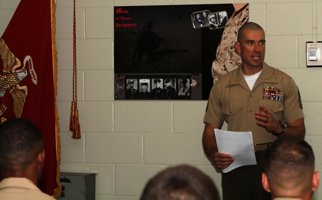 Gunnery Sgt. Jonathan Ferguson, director of Corporal's Course aboard Marine Corps Air Station Miramar, Calif., and a Dayton, Ohio, native, speaks to Marines about the schedule of the course they are attending at the air station, June 7. As the director for the course, Ferguson lays out the syllabus and expectations for the Marines to better understand.