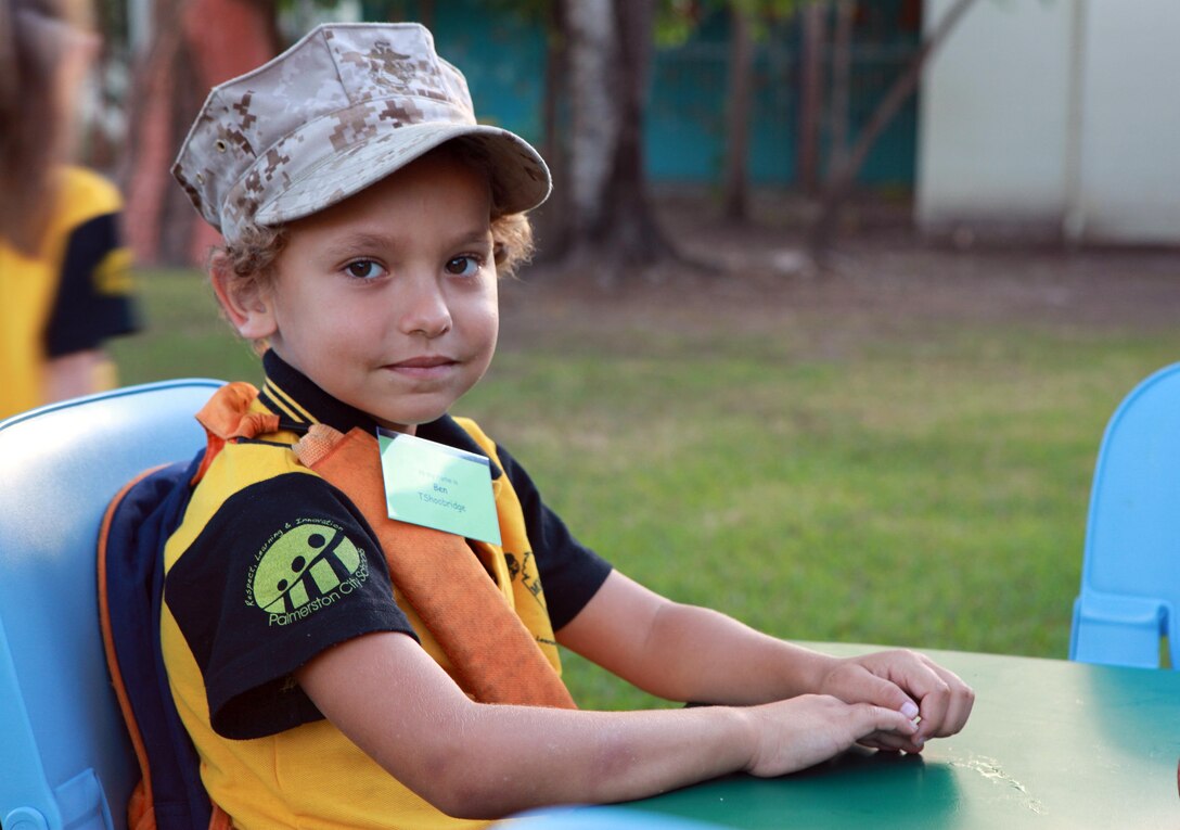 Ben, a student at Moulden Park Primary School, wears the hat of a Marine during an American breakfast, served by Marines, here, May 15. Every Monday, Wednesday and Friday, Marines with Marine Rotational Force - Darwin volunteer at Moulden to support the local community.