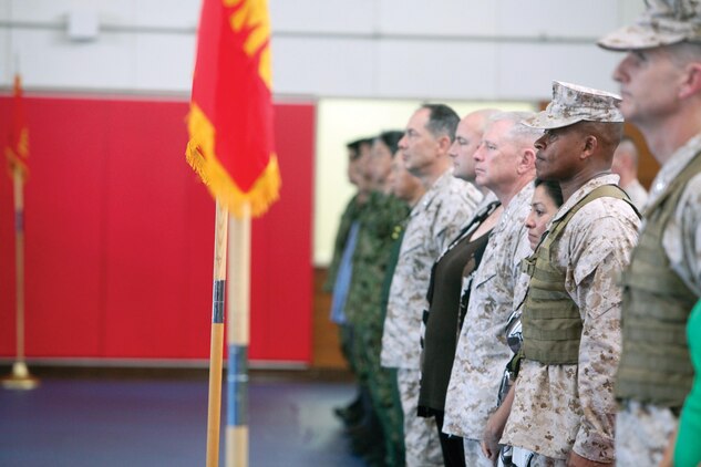Senior leaders of III Marine Expeditionary Force and Marine Corps Installations Pacific stand at attention during the conclusion of a change of command ceremony June 12 at Camp Courtney. Brig. Gen. Craig Q. Timberlake (2nd from the right), relinquished command to Col. John A. Ostrowski. Brig. Gen. Paul J. Kennedy will assume command later this summer. Timberlake will be the deputy commanding general, Regional Command North, International Security Assisstance Force, Afghanistan. 