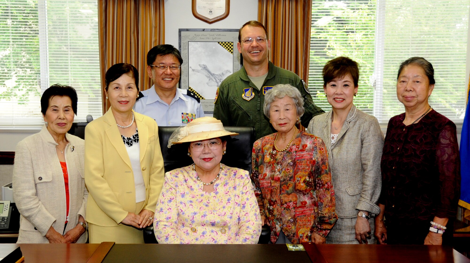 Members of the Fuyo-kai, or the Japan Air Self-Defense Ladies Group, Col. Stephen Williams, 35th Fighter Wing commander and, Maj. Gen. Nobuyoshi Kojima, Northern Air Defense Force vice commander, pose for a group photo in the wing commanders office at Misawa Air Base, Japan, June 12, 2013. This is the first time the Fuyo-Kai members traveled from Hamamatsu Air Base in Shizuoka Prefecture, Japan, to visit Misawa Air Base. (U.S. Air Force photo by Airman 1st Class Kenna Jackson)