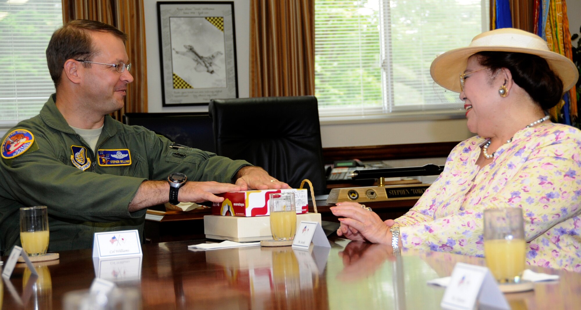 U.S. Air Force Col. Stephen Williams, 35th Fighter Wing commander, left, thanks Ms. Kayoko Suzuki, Japan Air Self-Defense Forces Ladies Group chairperson, for gifts received during the Office Call at Misawa Air Base, Japan, June 12, 2013. Fuyo-kai was established in 1996 and currently has 15 female volunteers with the intent to deepen mutual understanding between the local community and Hamamatsu Air Base through activities and social gatherings. (U.S. Air Force photo by Airman 1st Class Kenna Jackson)