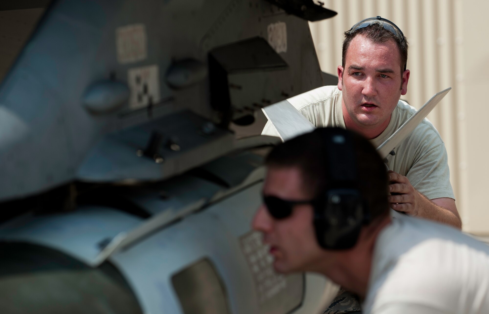 Senior Airman Ryan Ladda, 55th Expeditionary Fighter Squadron, 55th Expeditionary Aircraft Maintenance Unit weapons load crew member, deployed from Shaw Air Force Base, S.C., ensures the proper loading of a GBU-31 Version 1, Joint Direct Attack Munition at Kunsan Air Base, Republic of Korea, June 8, 2013. Ladda and two other teammates were judged on their reliability, technical proficiency, time and ability to safely load two munitions on an F-16 Fighting Falcon. (U.S. Air Force photo by Senior Airman Armando A. Schwier-Morales)