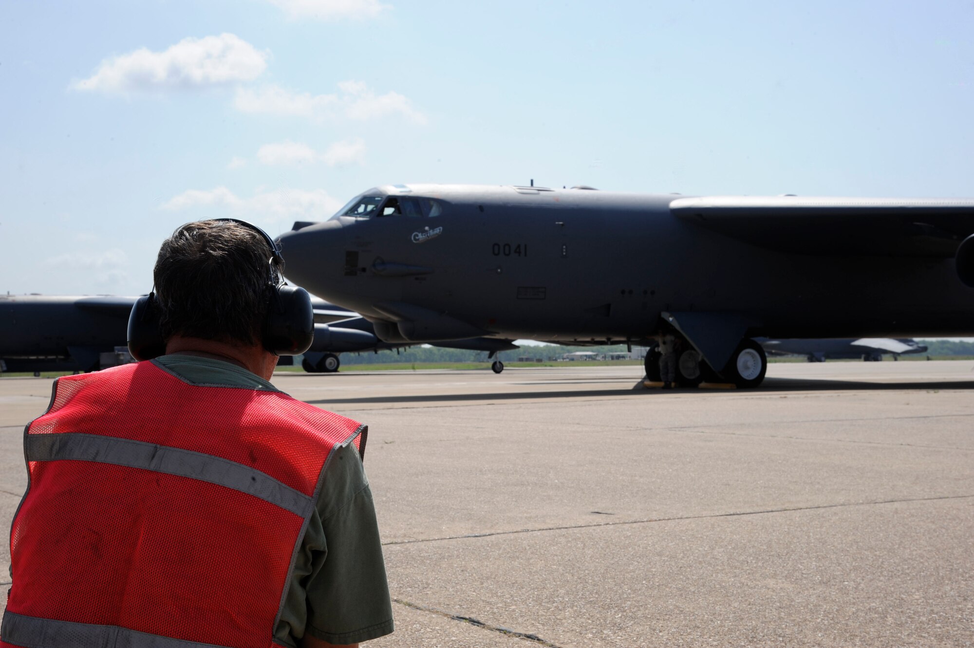 Tech. Sgt. Rob Johnson, 307th Maintenance Squadron, communicates with the crew of a B-52H Stratofortress on Barksdale Air Force Base, La., June 13, 2013. Crew chiefs are responsible for the maintenance and launching of aircraft, ensuring Barksdale's mission of delivering precision munitions to the battlefield is accomplished. (U.S. Air Force photo/Airman 1st Class Andrew Moua)