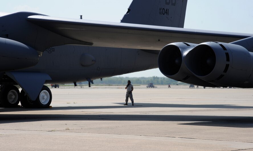 Tech. Sgt. Charles Burley, 307th Maintenance Squadron, communicates with the crew of a B-52H Stratofortress on Barksdale Air Force Base, La., June 13, 2013. Crew chiefs are responsible for the maintenance and launching of aircraft, ensuring Barksdale's mission of delivering precision munitions to the battlefield is accomplished. (U.S. Air Force photo/Airman 1st Class Andrew Moua)