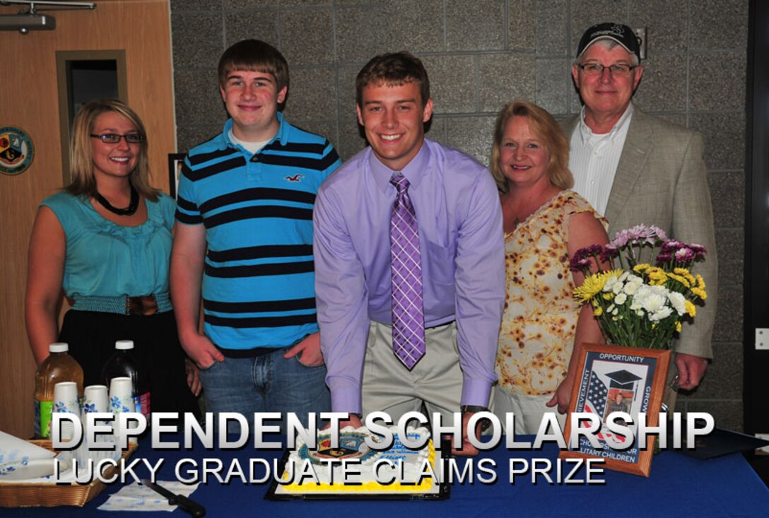 Elliott Pelfrey, military dependent, stands with his family after being presented with this year’s Scholarship for Military Children scholarship at the commissary at Cannon Air Force Base, N.M., June 13, 2013. The program was created in 2001 and is administered by the Fisher House Foundation, a nonprofit organization that provides assistance to service members and their families. (U.S. Air Force photo/Senior Airman Alexxis Pons Abascal) 