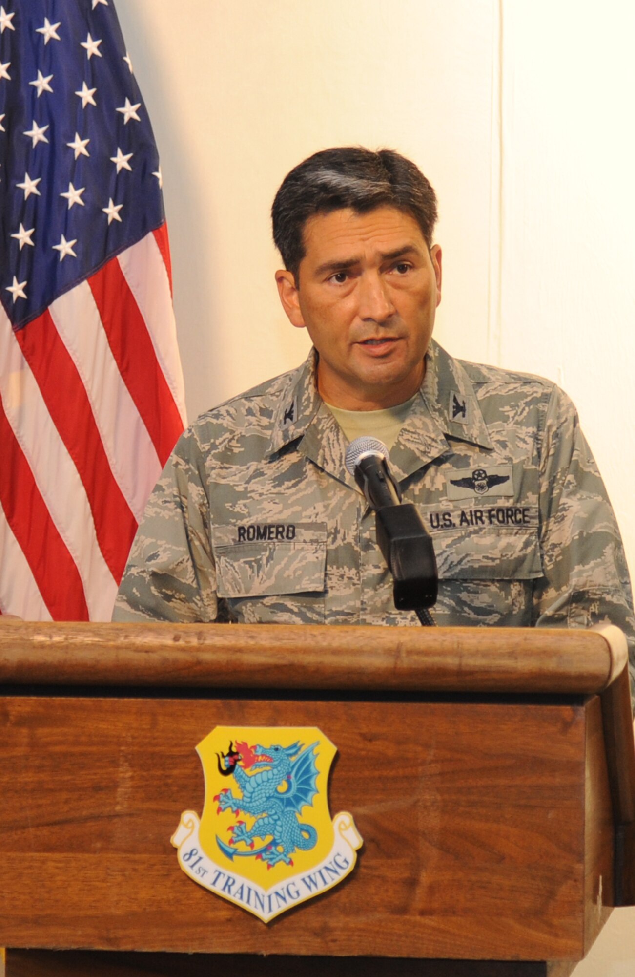 Col. René Romero, 81st Training Wing vice commander, speaks at a simulated press conference during Keesler's active shooter exercise, June 13, 2013, at Wall Studio, Keesler Air Force Base, Miss.  During the two-day exercise, an Air Force couple simulated opening fire, killing three people and injuring 41.  The exercise tested the base's ability to respond to and recover from a mass casualty event.  (U.S. Air Force photo by Kemberly Groue)